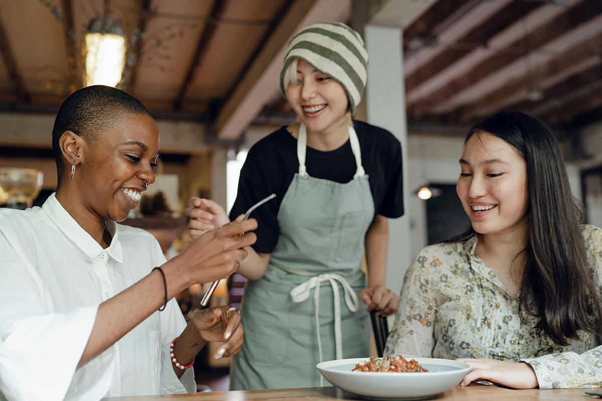 Person searching for nearby restaurants using restaurant picker wheel and lunch decider tool on mobile phone